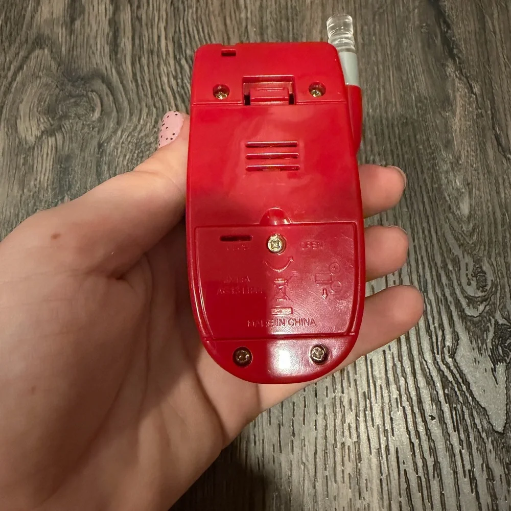 Source Unknown Red and Gray Flip Phone Toy with Red Ranger Graphic